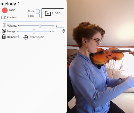 Music teacher recording harmony part of a violin duet to share with their student online